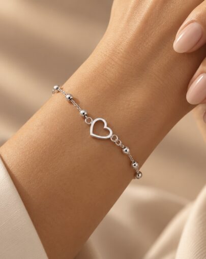 PULSERA CORAZON CALADO CON BOLITAS PLATA